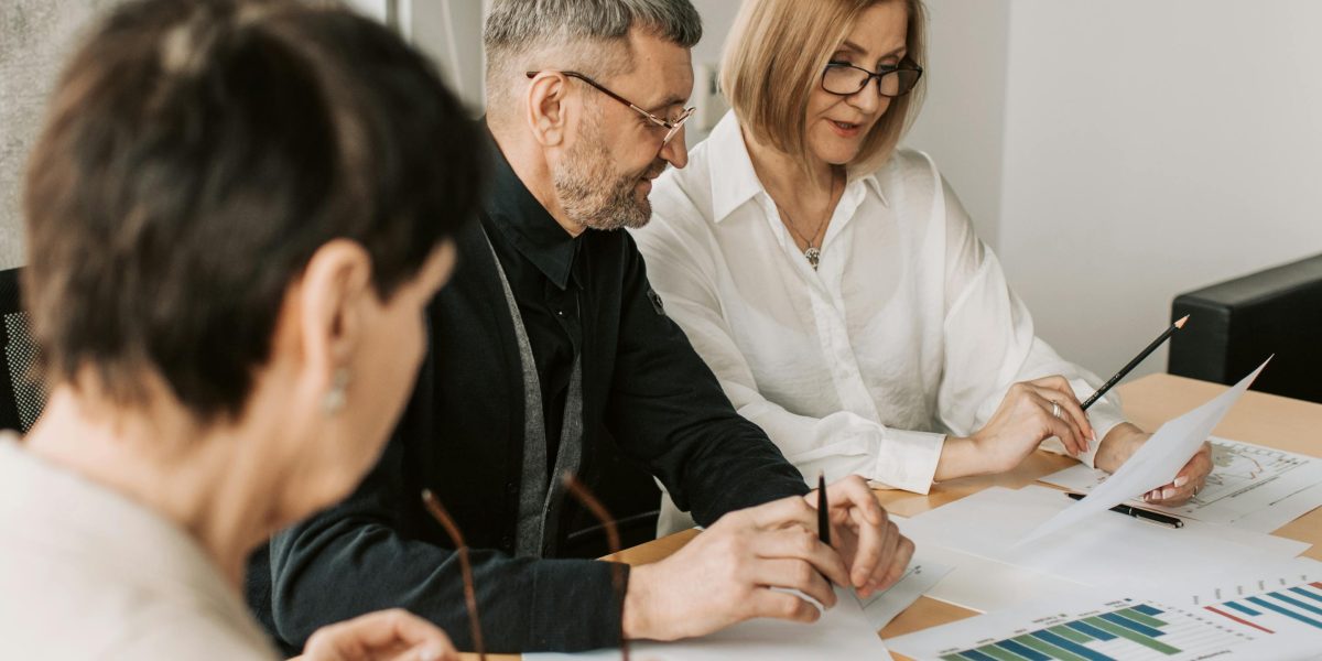 A diverse team collaborating to understand and navigate complex regulatory requirements.