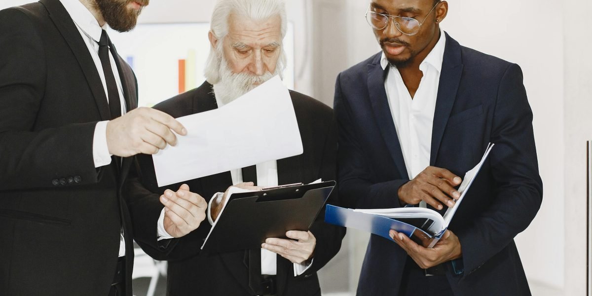 Professionals in a meeting discussing new business strategies due to market changes.