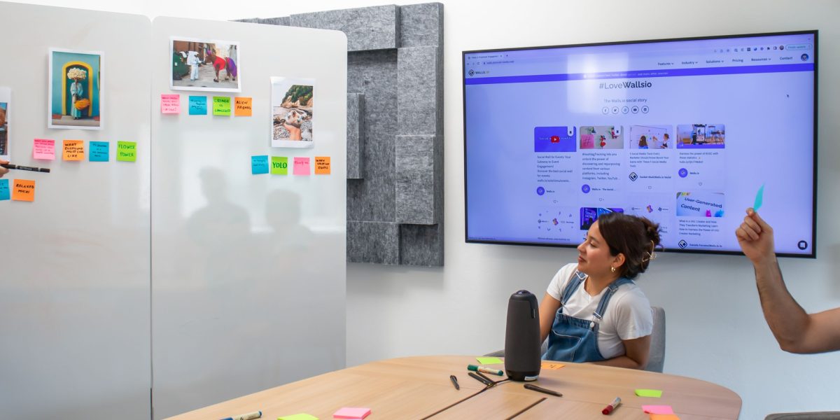 A team actively collaborates at a whiteboard, strategizing to overcome regulatory pain points and information fragmentation.