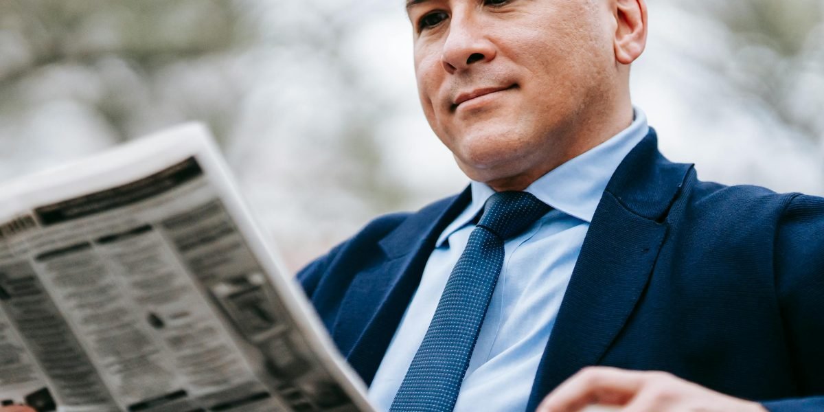 A person engaging with information, reflecting on the complex and sometimes confusing nature of AI news.