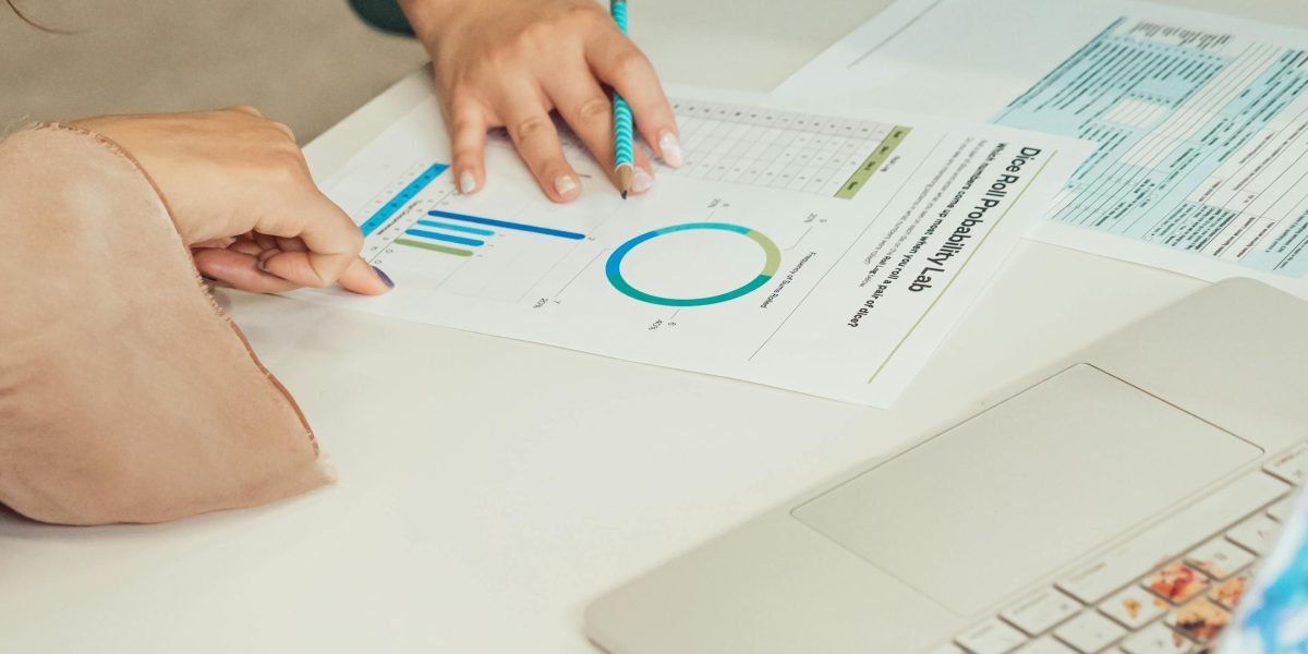 A professional reviews dashboards and reports, symbolizing the crucial process of measuring AI initiative ROI.