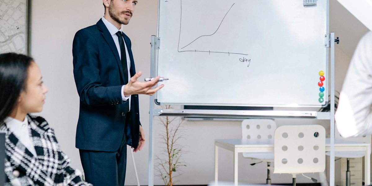 A business professional presents a compliance strategy, emphasizing a proactive approach to autonomous AI regulation.