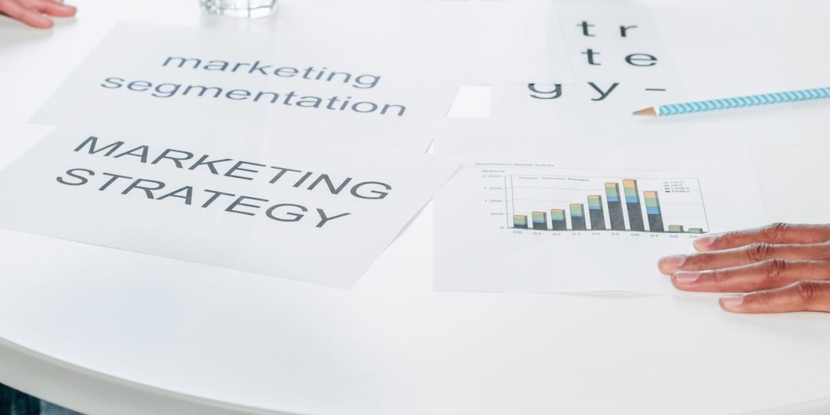 A diverse team of professionals actively collaborating around a table, brainstorming strategies.