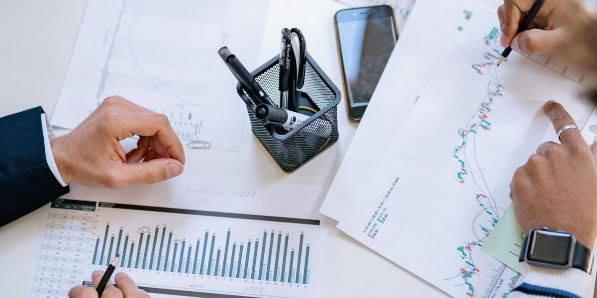 A team conducting a risk assessment, thoughtfully considering potential problems and their impact on the business.