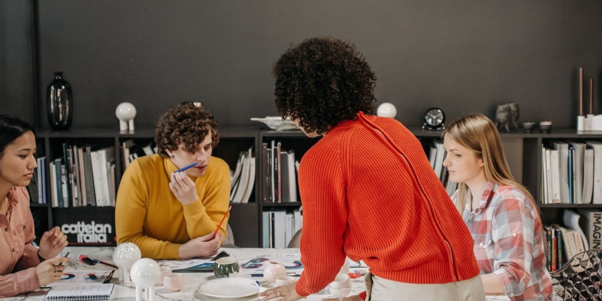 People collaborating dynamically, brainstorming new concepts that reflect advanced technologies like AI and biotech.