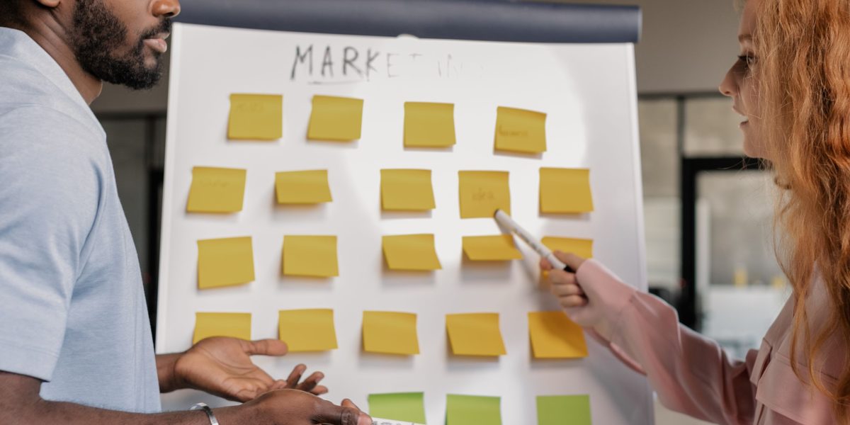 A marketing team collaborating on a campaign, leveraging AI to accelerate content production.