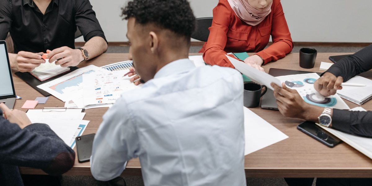 A small team of professionals collaborating, reflecting Cybertex's emphasis on practical training and industry-experienced instructors.