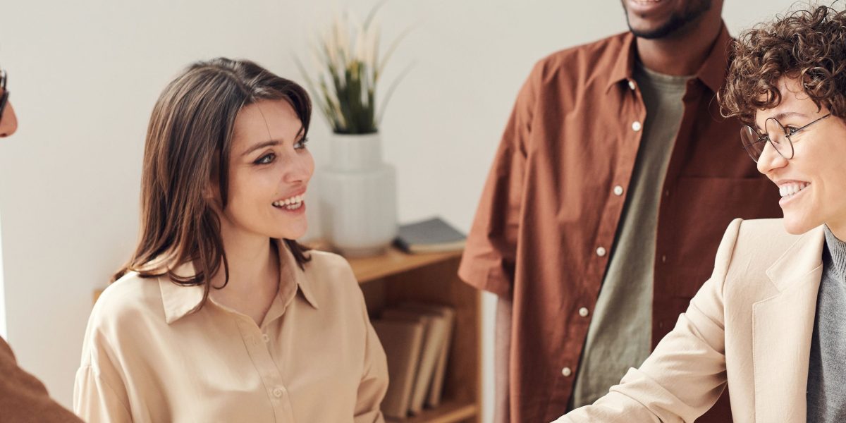Two professionals shaking hands, symbolizing successful job placement and strong employer relationships.
