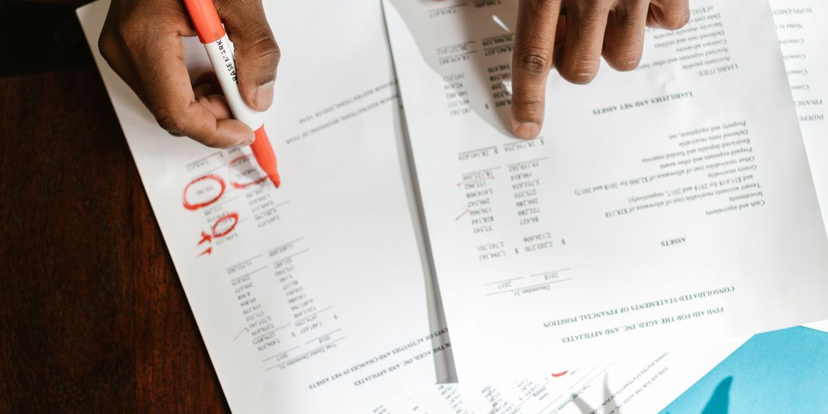 A person reviewing strategic documents, representing human roles requiring critical thinking and judgment.