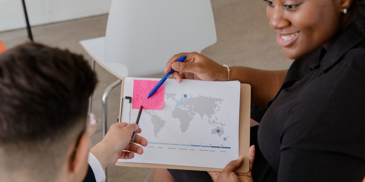 Professionals from different backgrounds collaborate during a global meeting, symbolizing international partnerships and competitive dynamics.