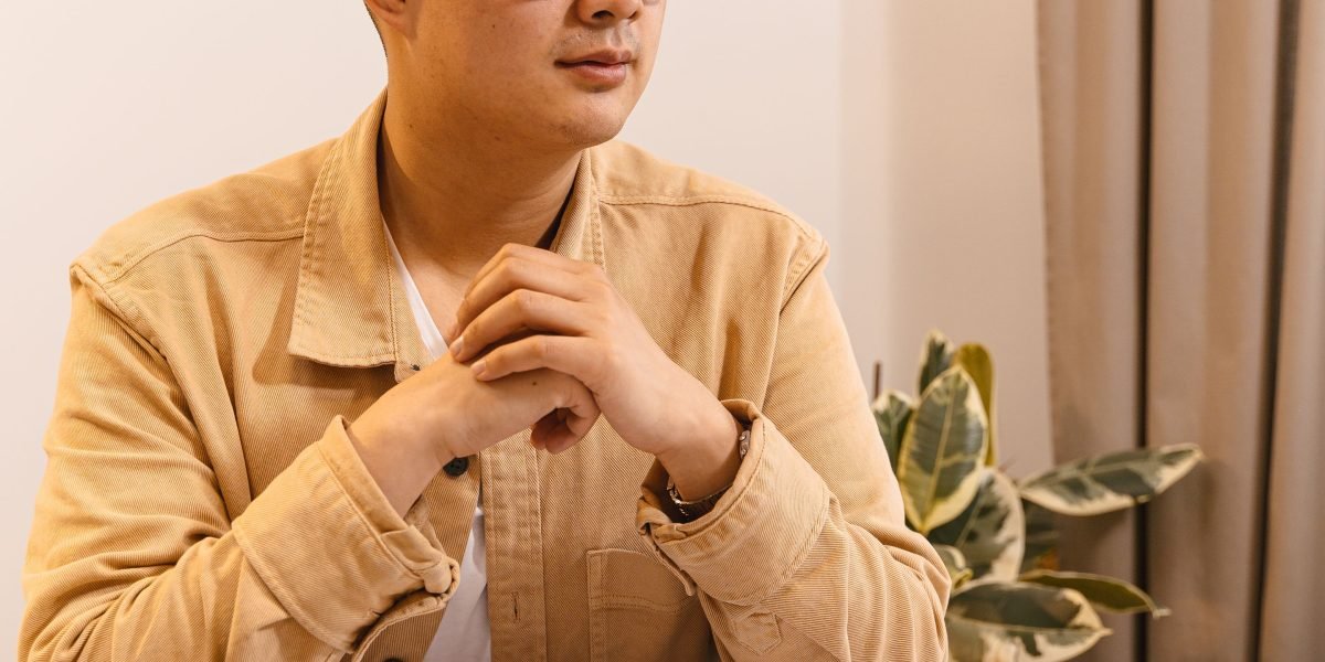 A person intently studying a complex diagram, symbolizing the need for clear understanding and explainability in AI decisions.