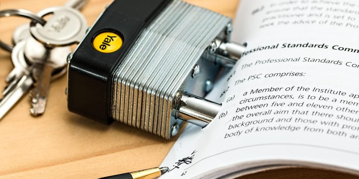 A person diligently reviewing legal documents, symbolizing the need for thorough understanding of AI regulations and compliance.
