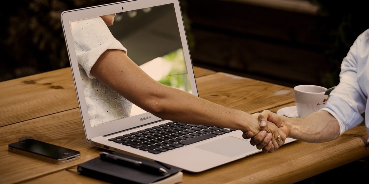 A diverse team collaborates, strategizing how to adapt AI products for varied global regulations.