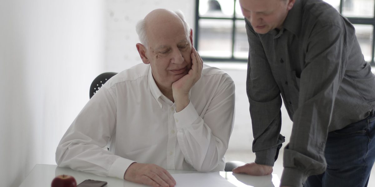 An experienced mentor guiding a new employee, metaphorically representing AI model training.