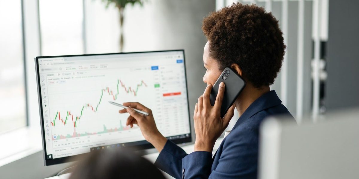 Financial professionals reviewing market data and reports, illustrating the impact of AI regulation on investment decisions.
