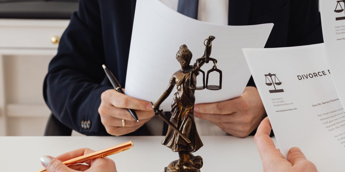 Professionals reviewing legal documents to ensure compliance with new regulations.