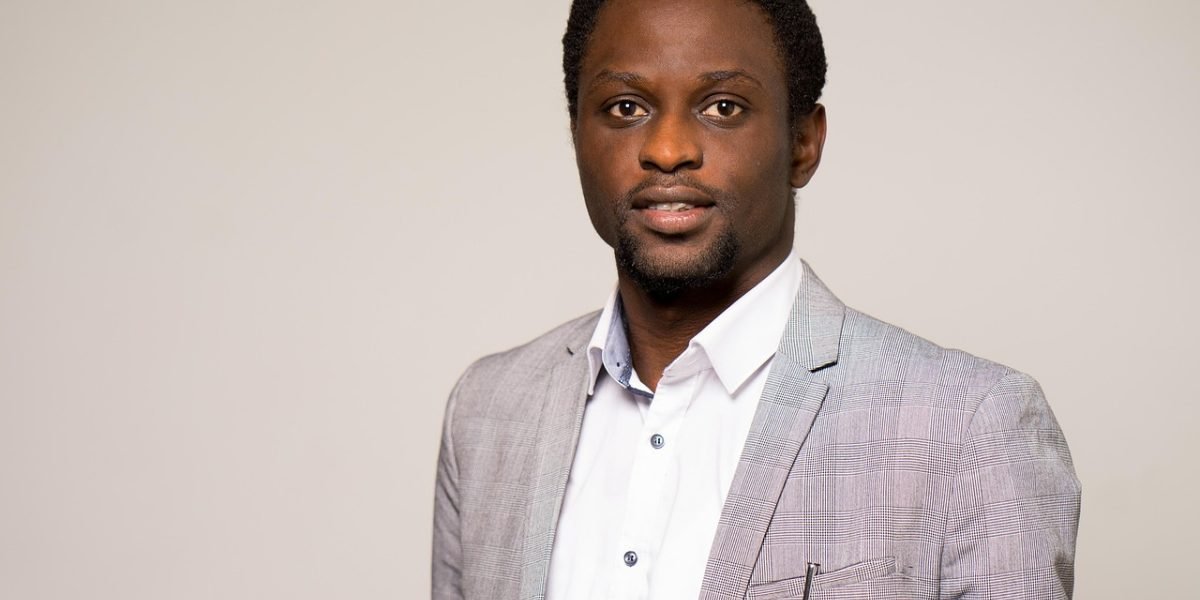 A confident human resources professional smiling, representing successful talent acquisition and employee management.