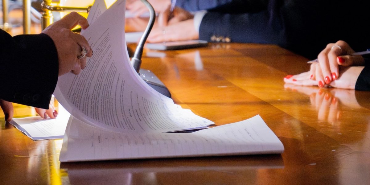 Legal and product teams collaborating to analyze new regulations and plan immediate actions.
