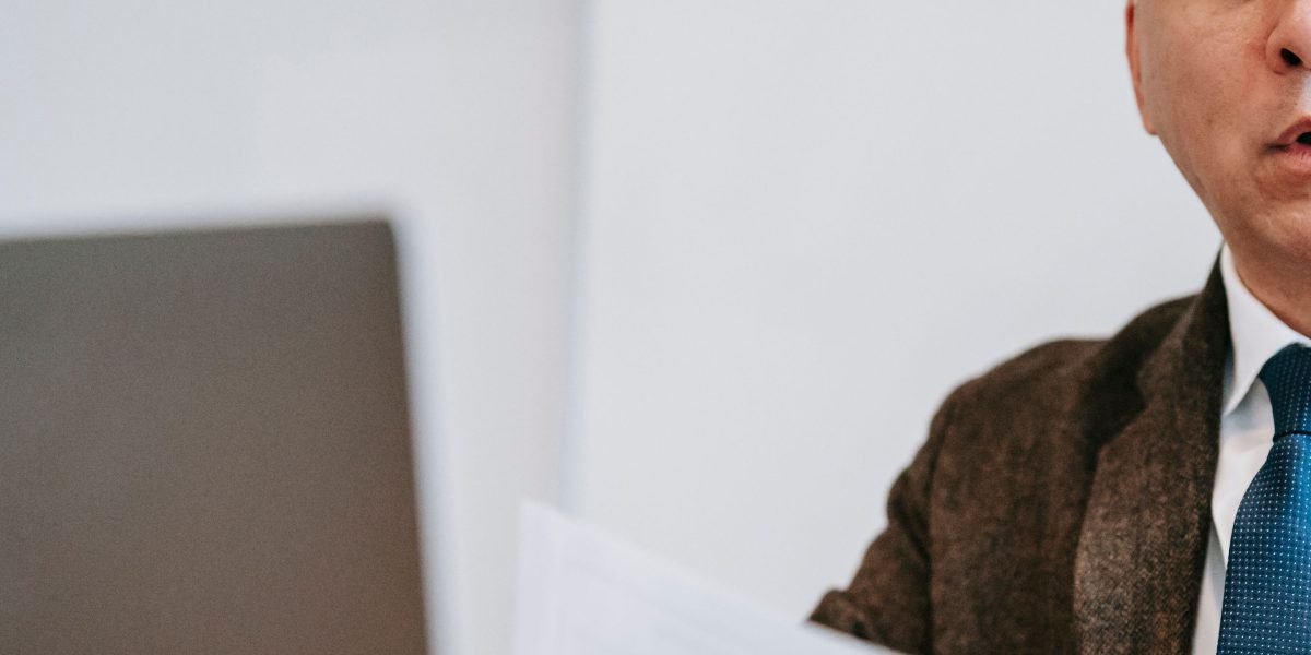 An individual engaging in online learning, enhancing their skills to adapt to AI-augmented roles.