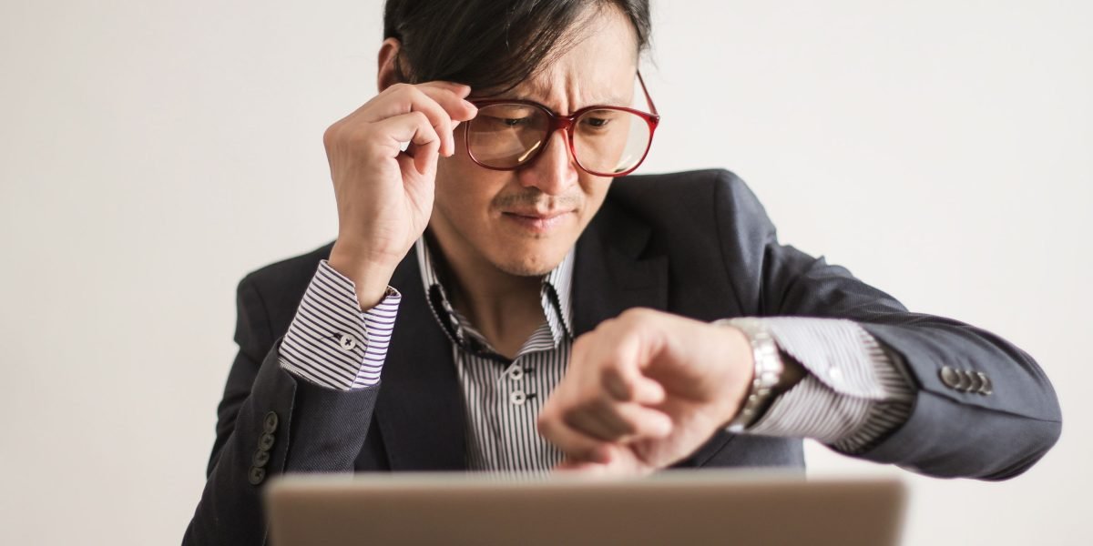 An employee subtly using an unapproved tool, representing the hidden nature of shadow tech in the workplace.