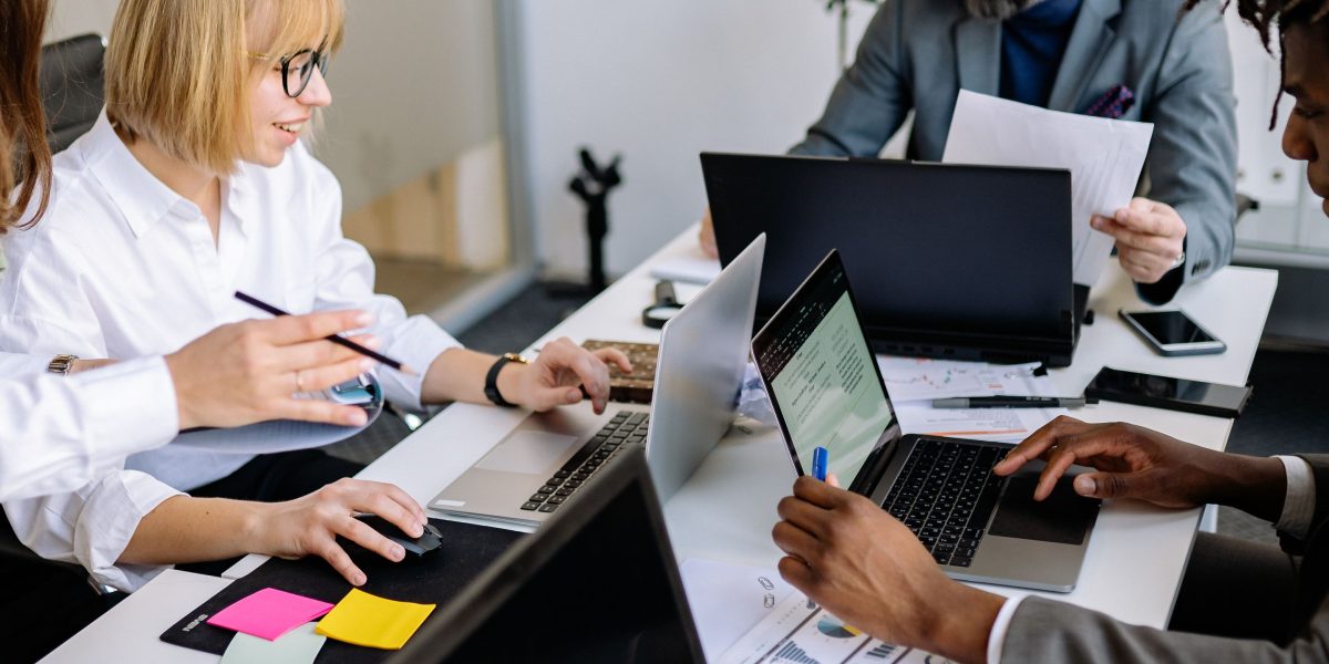 A diverse team collaborating actively, symbolizing the integration of AI to drive new product features and market innovation.