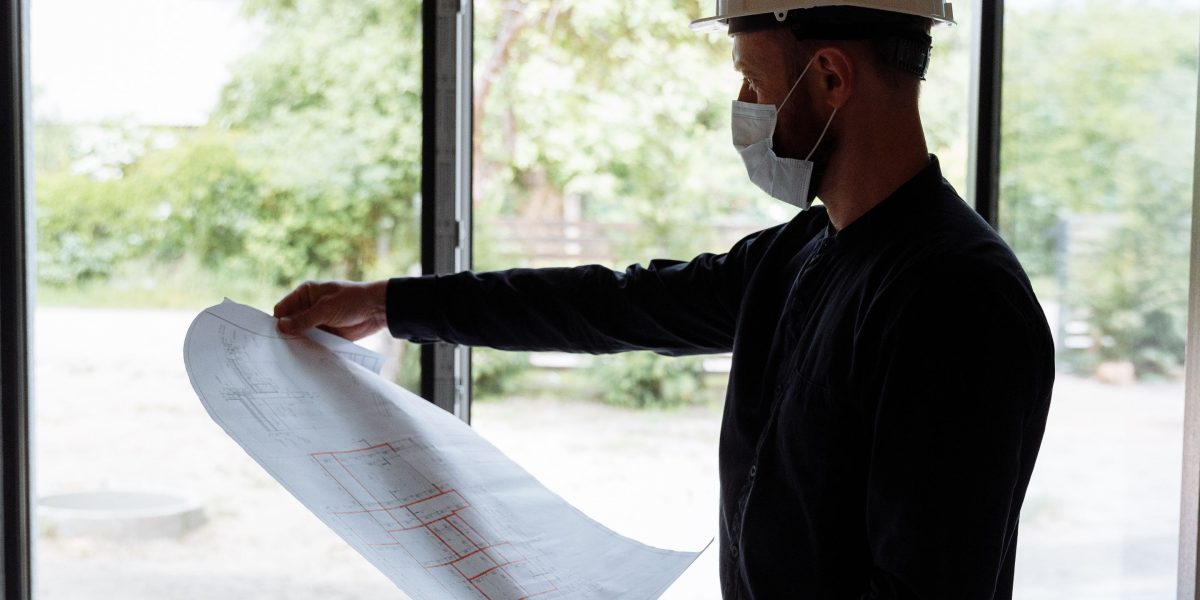 A professional deeply engaged in reviewing documents, symbolizing detailed planning for AI cost estimation.