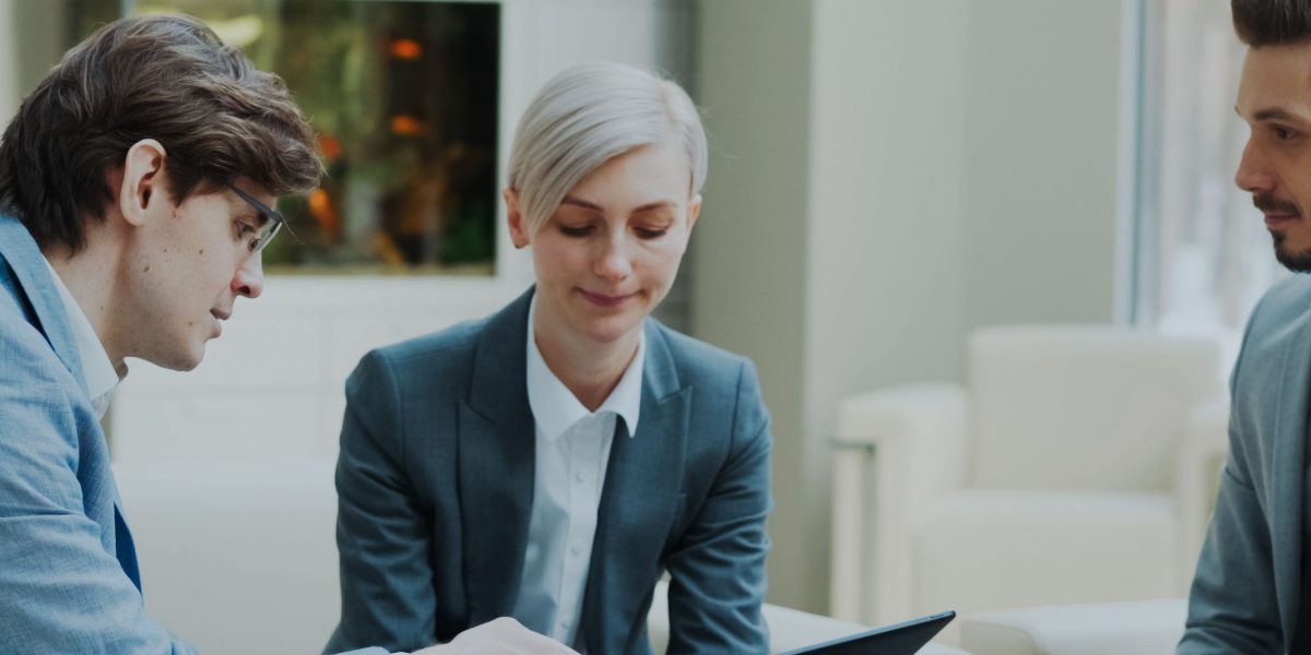 Professionals engage in strategic discussion, envisioning the future shaped by rapid AI advancements.