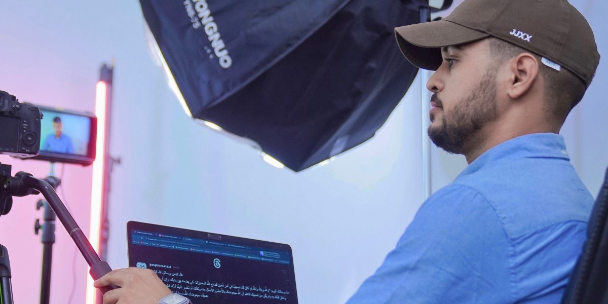 A creative professional focused on editing video content on a workstation, representing content creation with AI tools.