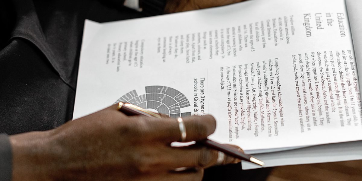 A professional meticulously reviewing data, symbolizing the challenge of detecting synthetic media.