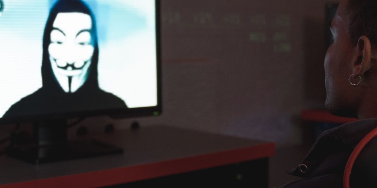 An individual thoughtfully considering and safeguarding digital privacy and biometric information.