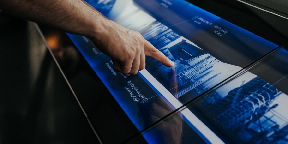 A person appears focused, sifting through multiple information sources, representing the fragmented news landscape.