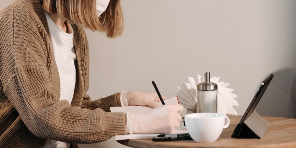An individual staying informed on the latest AI news and regulatory updates using a tablet in a casual setting.